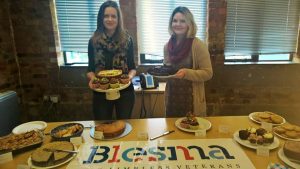 Claire and Hannah with their cakes for blesma cake sale