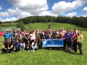 Group of people with medals who took part in Go Wild For Headway 2019