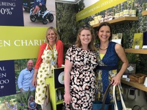 Alex Dabek and Victoria Oliver in the company of Horatio’s Garden volunteers at their stand during Royal Chelsea Flower Show