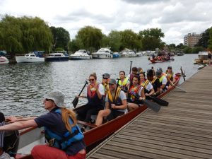 Dragon boat and team of rowers on the water