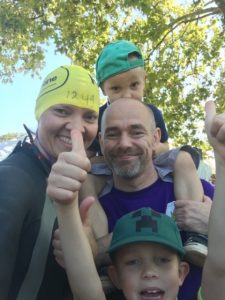 Alex Dabek from Bolt Burdon Kemp with family before the Swim Serpentine Challenge