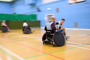 Ahmed Al-Nahhas in wheelchair with ball