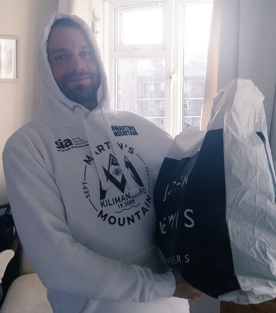 Tom Lax in Charity clothes